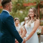 Bride and groom exchanging vows at outdoor wedding ceremony Downham Hall Essex