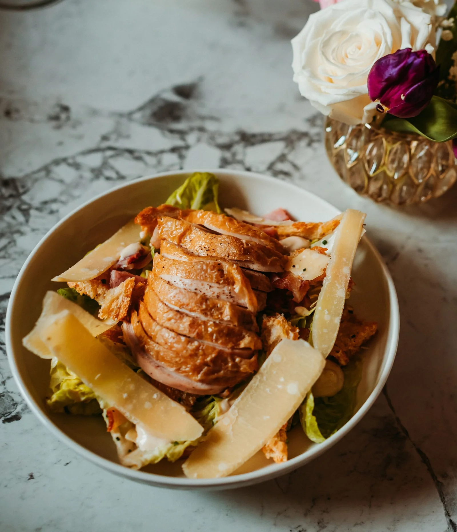 Grilled chicken Caesar salad with parmesan served for lunch at Downham Hall Essex