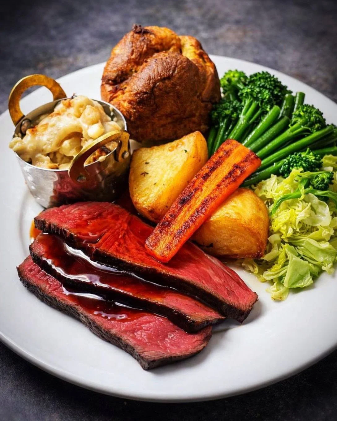 Traditional Sunday roast beef with Yorkshire pudding and vegetables at Downham Hall Essex