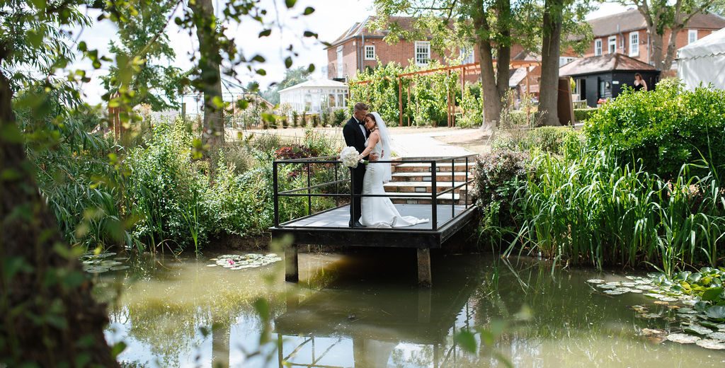 Sustainable wedding venue at Downham Hall Essex — Hollingsworth Jetty over restored moat