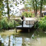 Sustainable wedding venue at Downham Hall Essex — Hollingsworth Jetty over restored moat