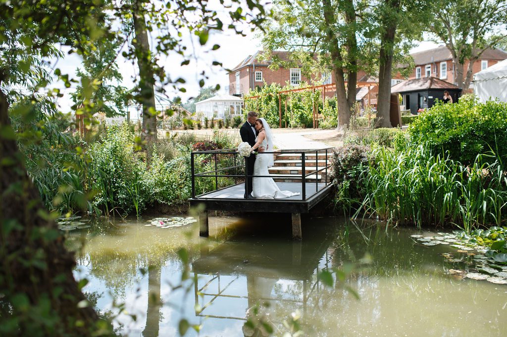 Sustainable wedding venue at Downham Hall Essex — Hollingsworth Jetty over restored moat